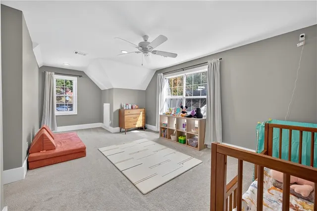 a bedroom with furniture and a window