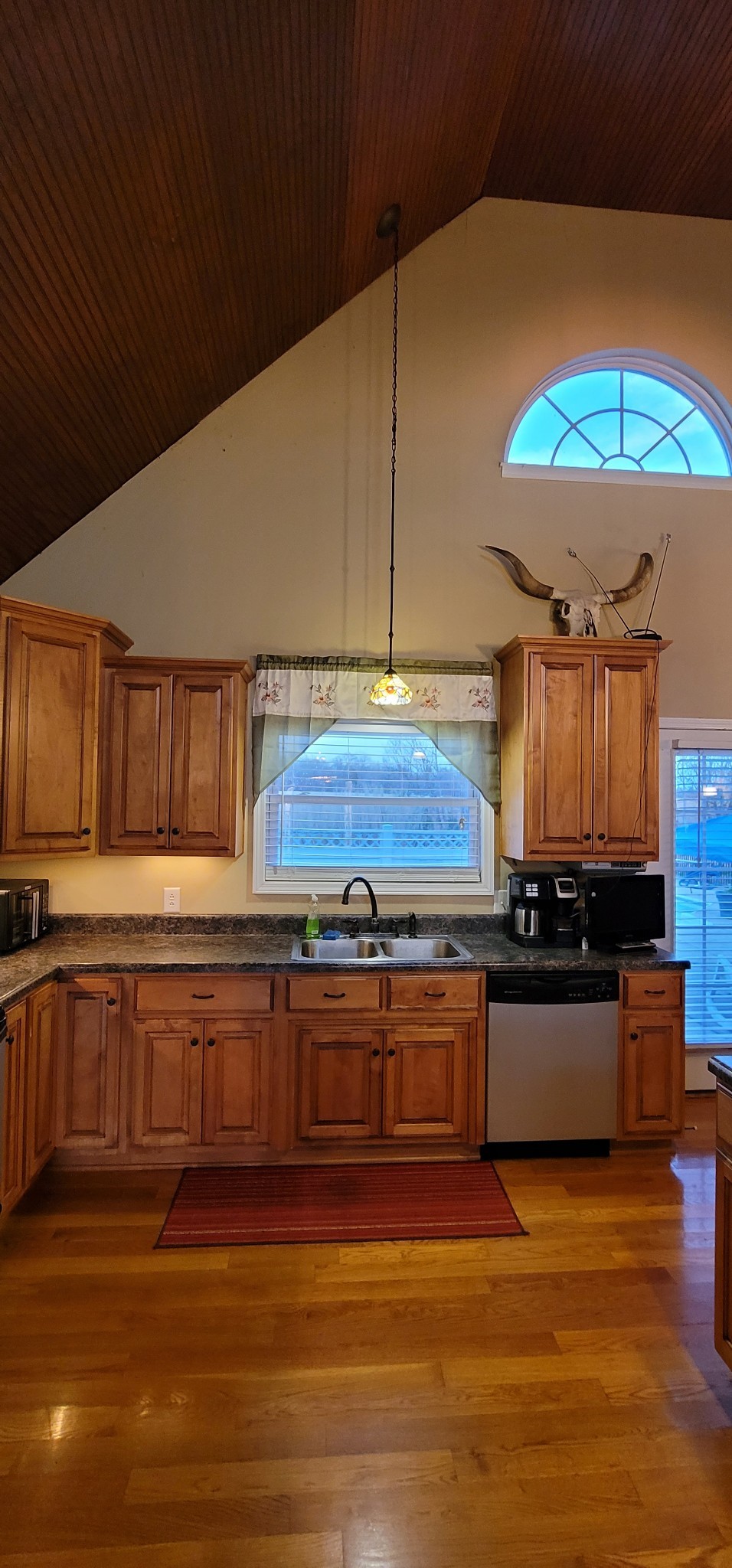 6197 H B Lee Road Springfield, TN 37172 - Photo 19 of 60 a kitchen with stainless steel appliances granite countertop a stove a sink and a microwave oven