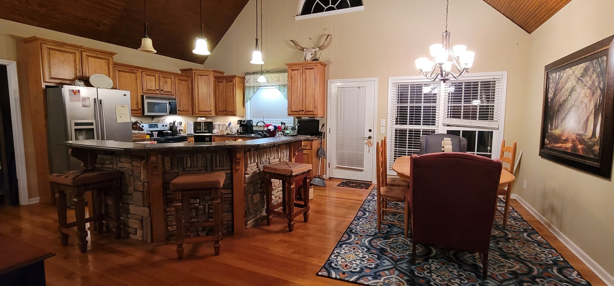 6197 H B Lee Road Springfield, TN 37172 - Photo 23 of 60 a view of a dining room with furniture and a chandelier
