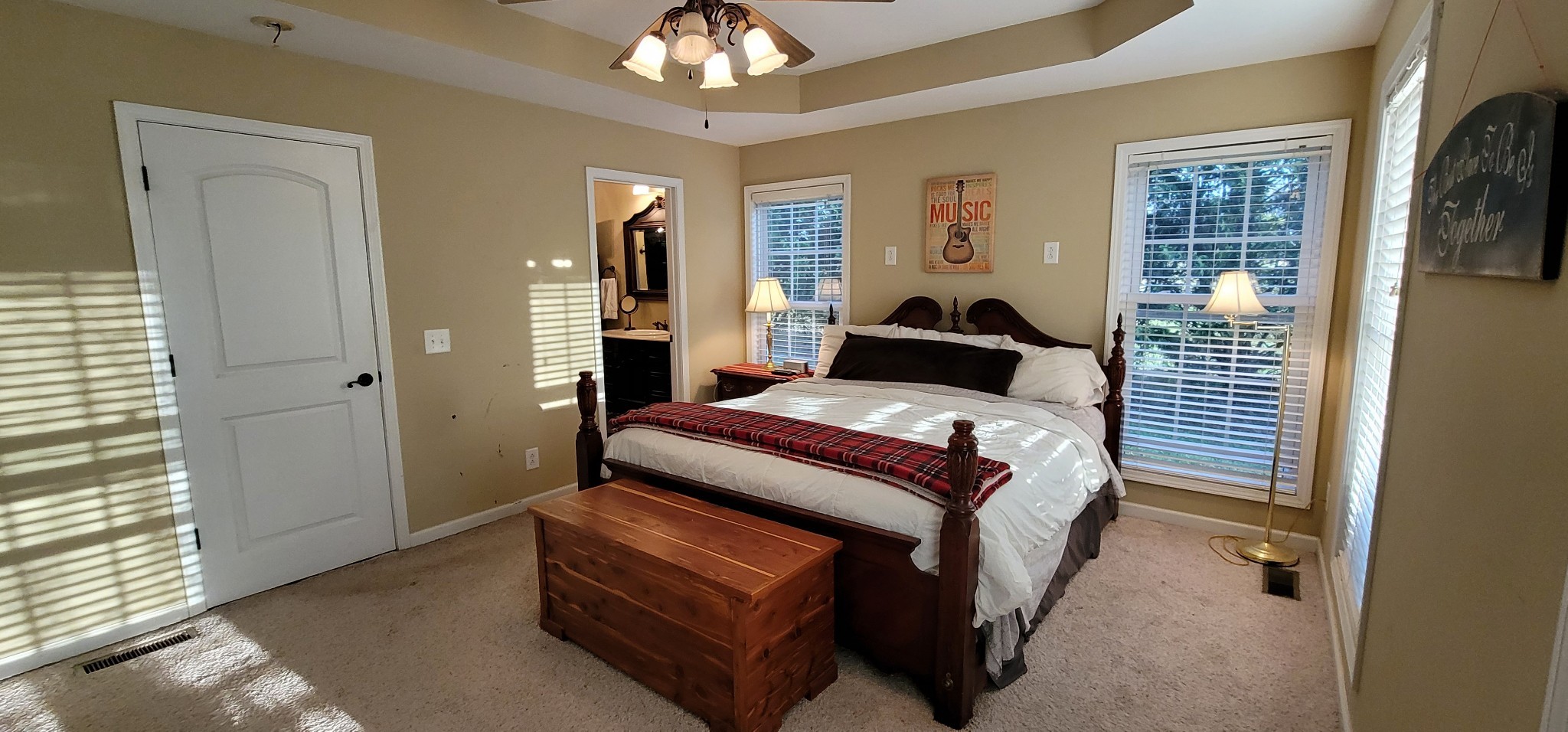 6197 H B Lee Road Springfield, TN 37172 - Photo 28 of 60 a bedroom with a bed and a chandelier