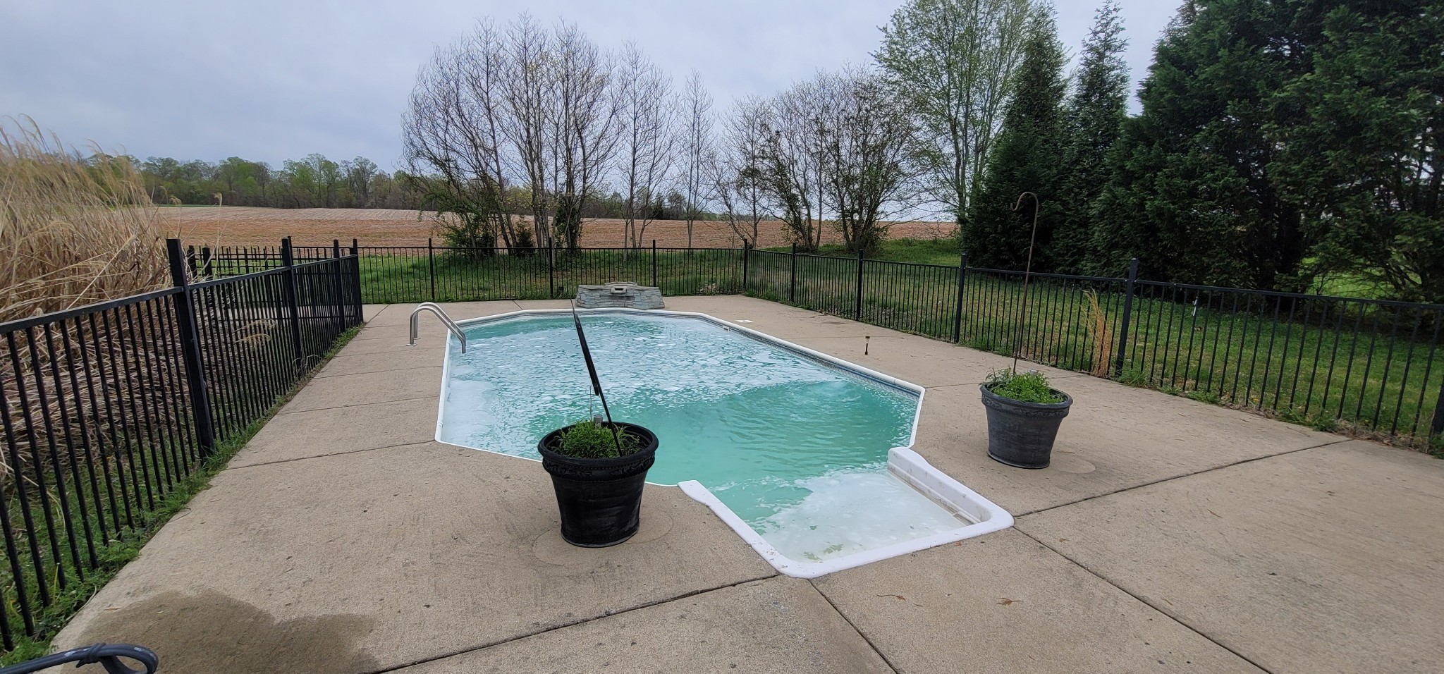 6197 H B Lee Road Springfield, TN 37172 - Photo 45 of 60 a view of a patio with a table and chairs next to a lake