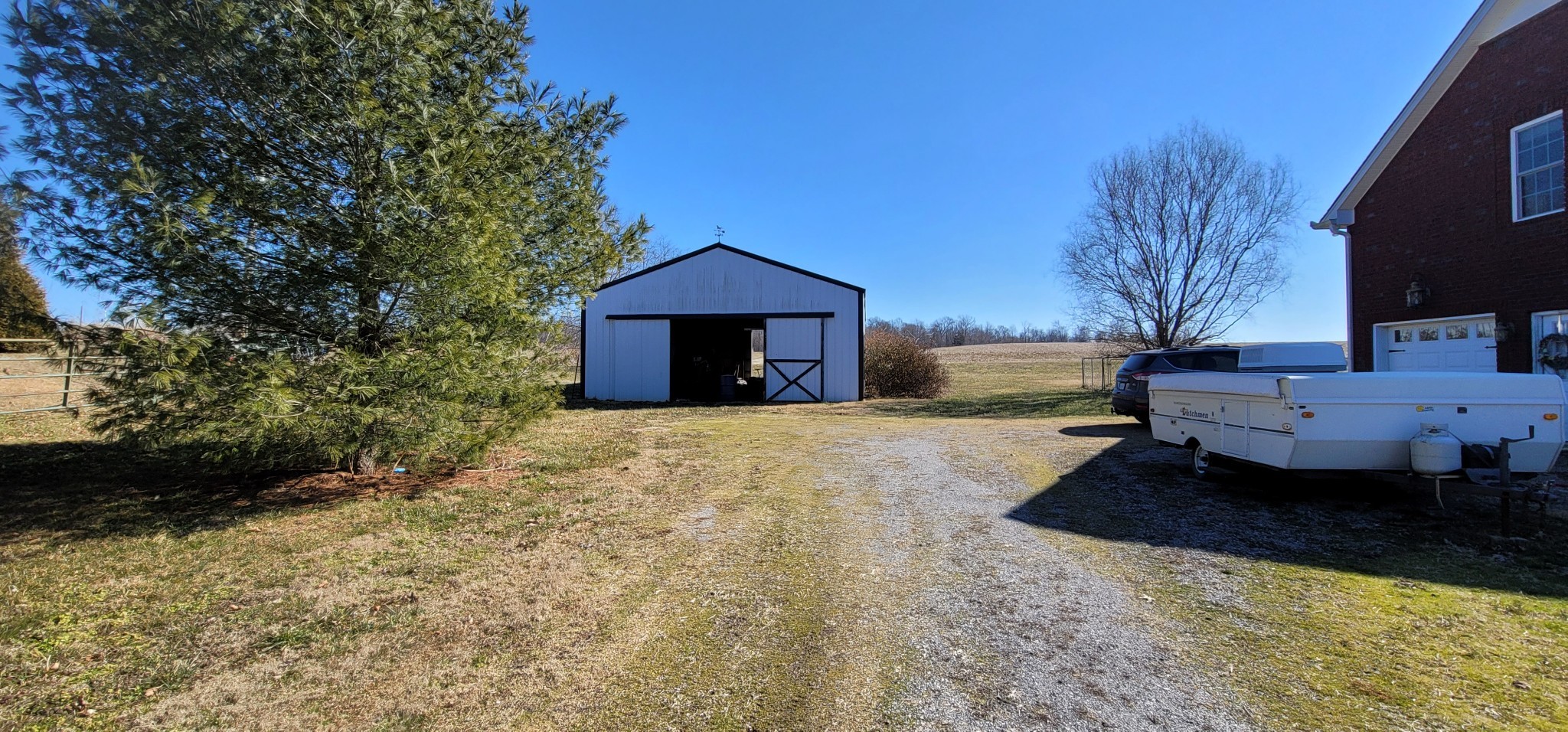 6197 H B Lee Road Springfield, TN 37172 - Photo 50 of 60 a view of a house with backyard and trees