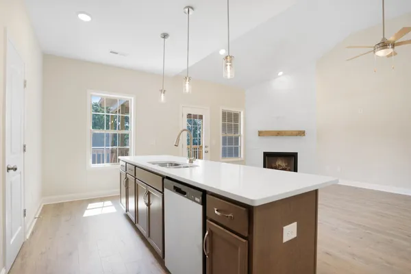a kitchen with a stove and a sink