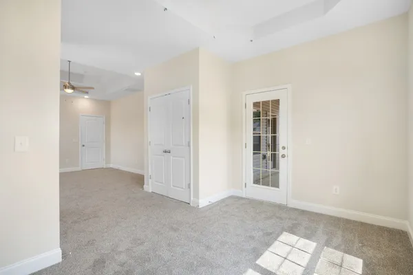 a view of an empty room with a entryway