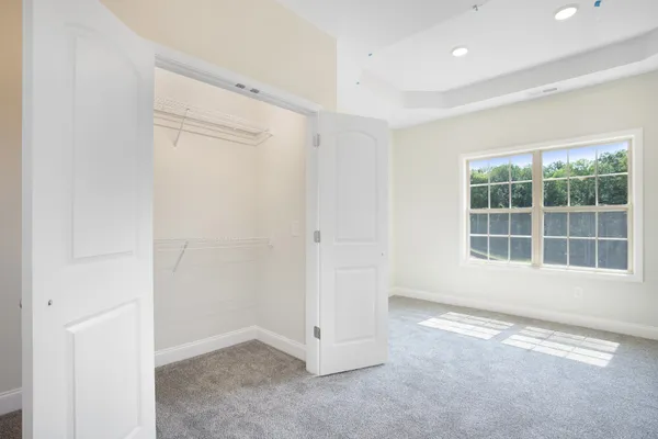 an empty room with a empty space and windows