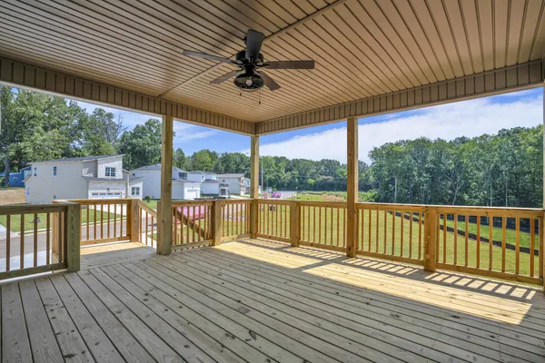 a view of a house with backyard and porch