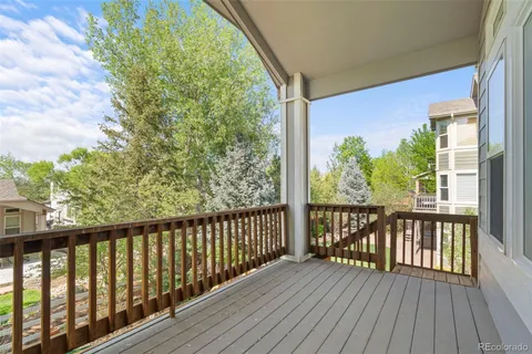 a view of balcony with wooden floor
