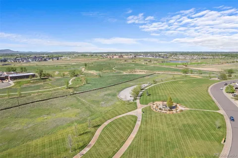 a view of a swimming pool and an outdoor seating