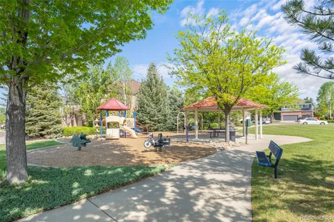 a row of palm trees in front of the house