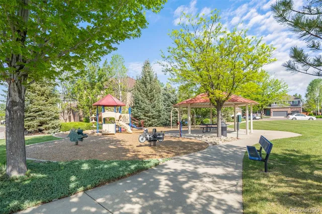 a row of palm trees in front of the house