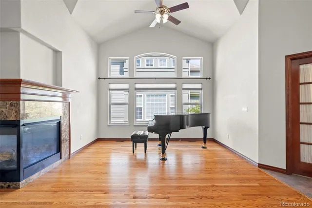 a view of a livingroom with furniture wooden floor and a window