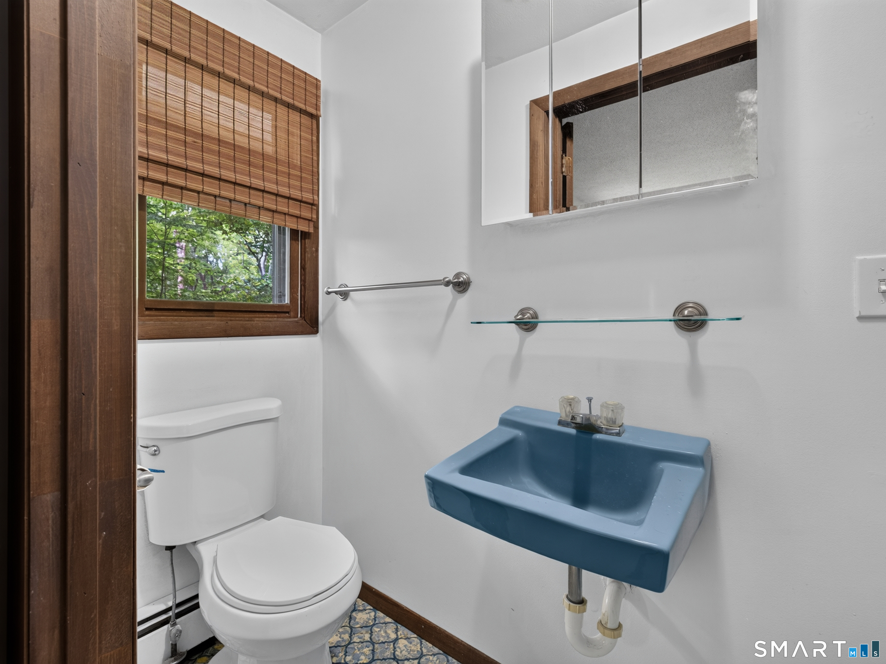 75 Airline Road Clinton, CT 06413 - Photo 23 of 37 a bathroom with a sink a toilet and a mirror