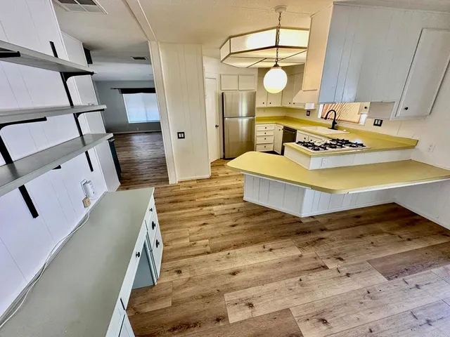 a living room with table and chairs