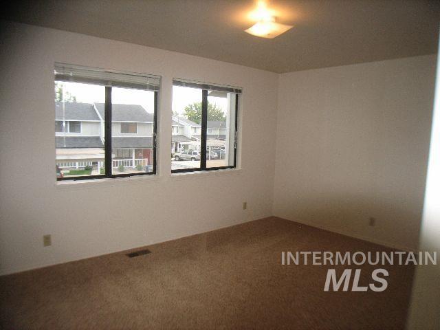 1484 East Carter Lane Boise, ID 83706 - Photo 5 of 9 Empty room featuring carpet floors