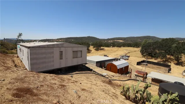 a view of a house with a mountain and a mountain view