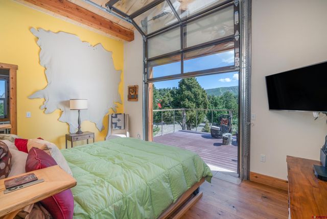 a bedroom with furniture and a book shelf