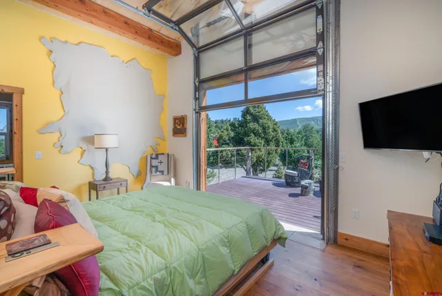 a bedroom with furniture and a book shelf