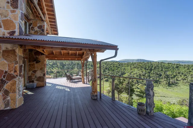 a view of a deck with wooden floor and outer view