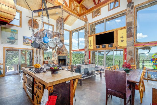 a view of a dining room with furniture and a window