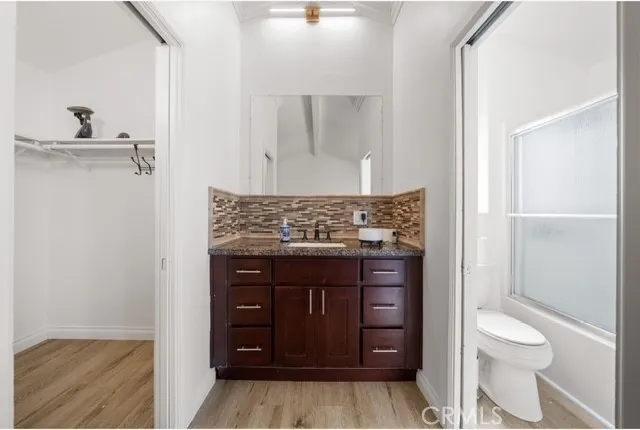 a bathroom with a toilet and a sink