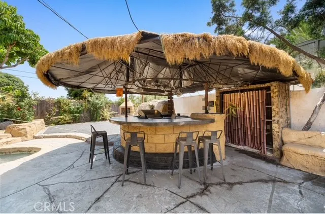 a patio with a patio table and chairs
