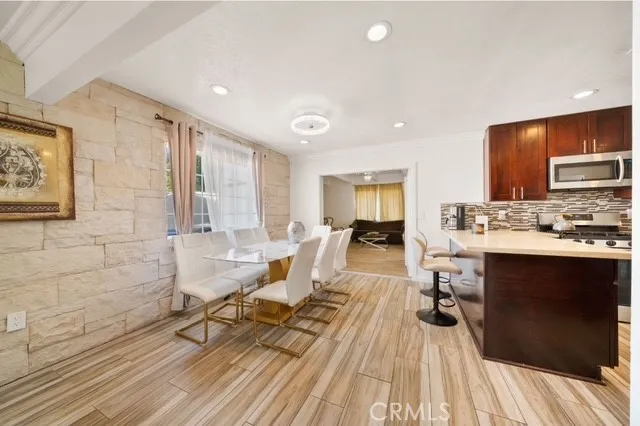 a living room with a couch and a wooden floor