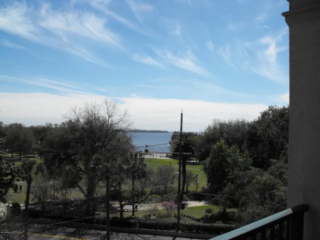 a table with a vase and chandelier