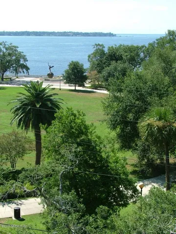 an aerial view of a house with yard