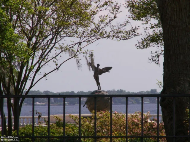 a view of a yard from a balcony