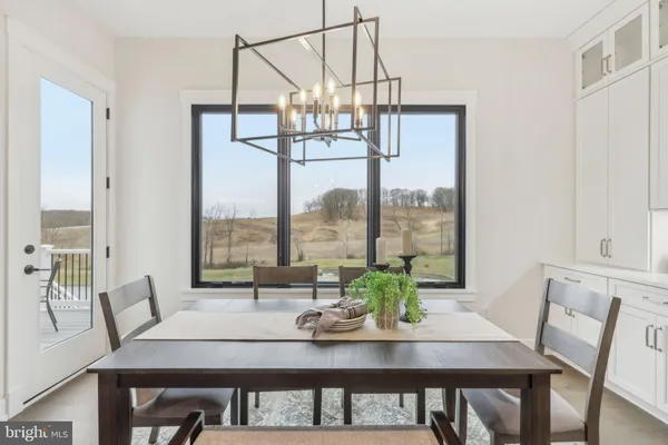 a view of a dining room with furniture window and outside view