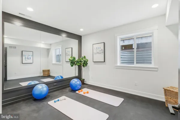 a room with furniture and potted plant