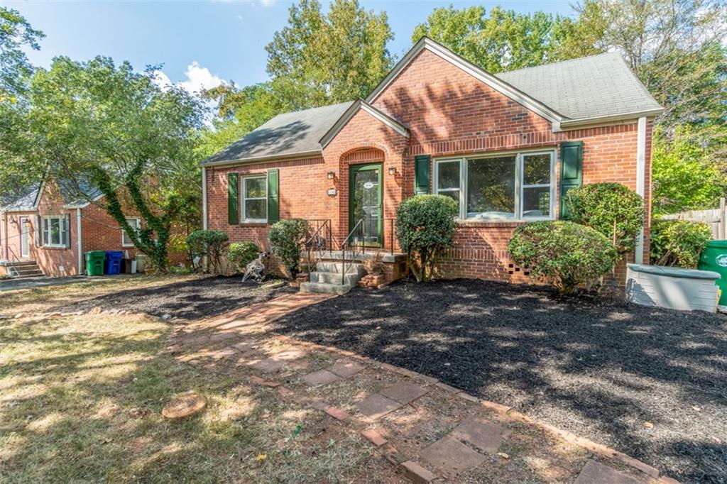 1185 Walker Drive Decatur, GA 30030 - Photo 1 of 1 a front view of a house with garden