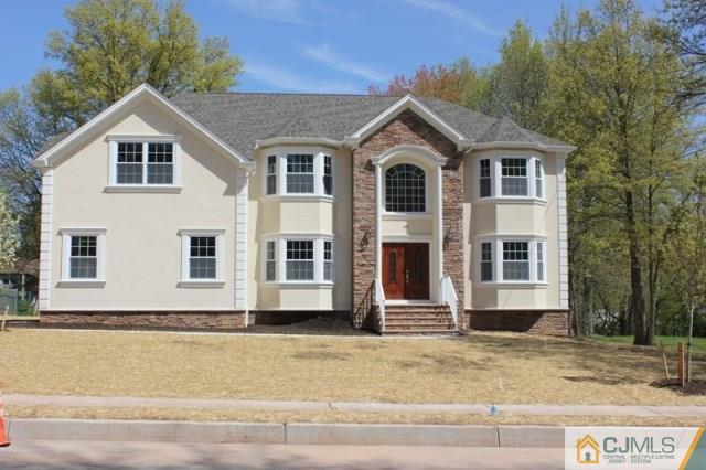 4 Herron Road Edison, NJ 08820 - Photo 1 of 25 a front view of a house with a yard
