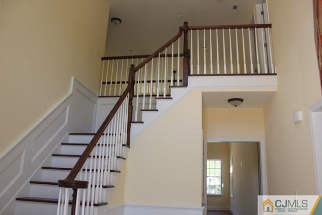 4 Herron Road Edison, NJ 08820 - Photo 2 of 25 a view of staircase with wooden floor and stairs