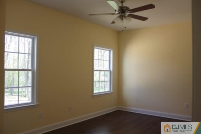 4 Herron Road Edison, NJ 08820 - Photo 11 of 25 an empty room with windows and fan