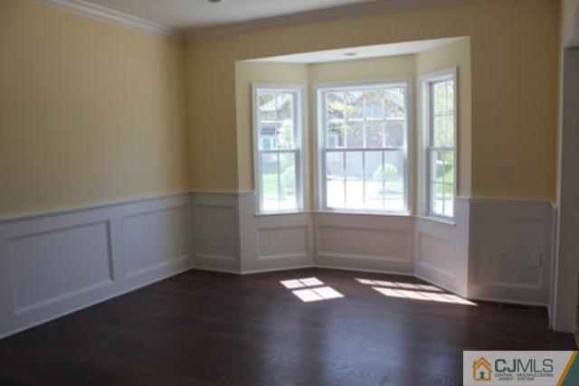 4 Herron Road Edison, NJ 08820 - Photo 12 of 25 an empty room with wooden floor and windows