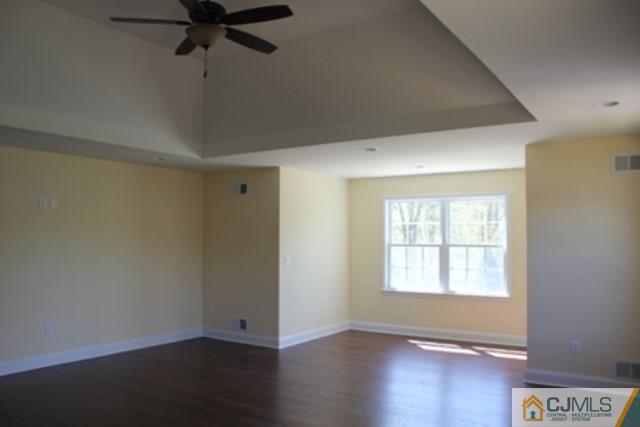 4 Herron Road Edison, NJ 08820 - Photo 21 of 25 an empty room with wooden floor fan and windows
