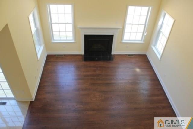 4 Herron Road Edison, NJ 08820 - Photo 23 of 25 wooden floor in an empty room with a window