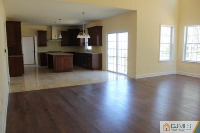 4 Herron Road Edison, NJ 08820 - Photo 8 of 25 an empty room with wooden floor and windows