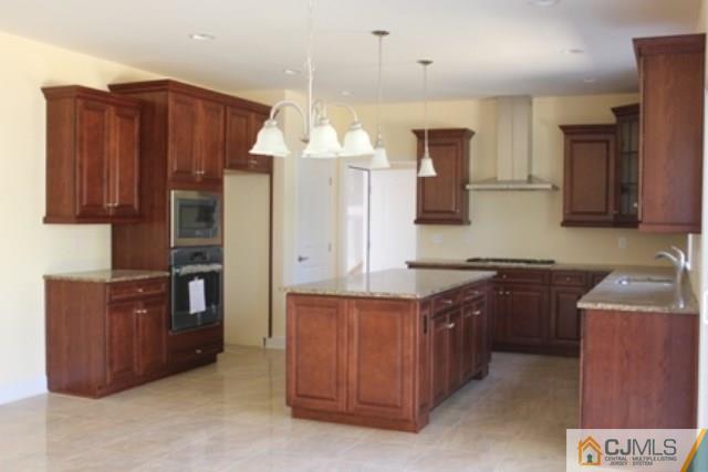 4 Herron Road Edison, NJ 08820 - Photo 10 of 25 a kitchen with stainless steel appliances granite countertop wooden cabinets a stove a sink and a refrigerator