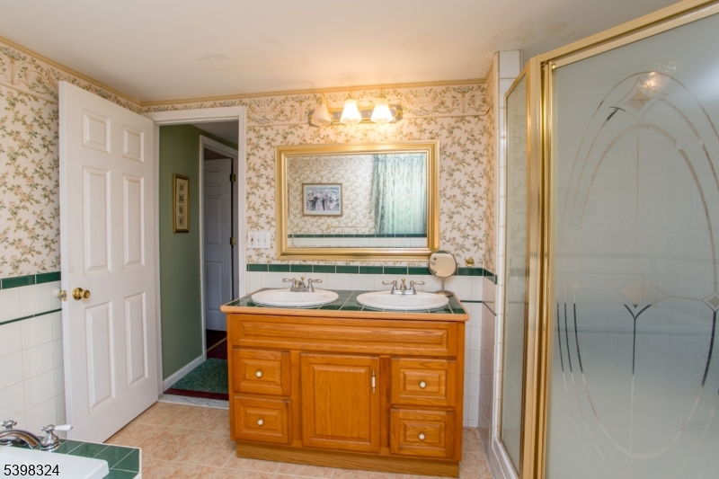 47 Hewitt Road Stockton, NJ 08559 - Photo 23 of 31 a bathroom with a sink and a mirror