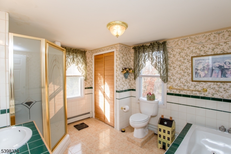 47 Hewitt Road Stockton, NJ 08559 - Photo 24 of 31 a bathroom with a granite countertop sink toilet and shower