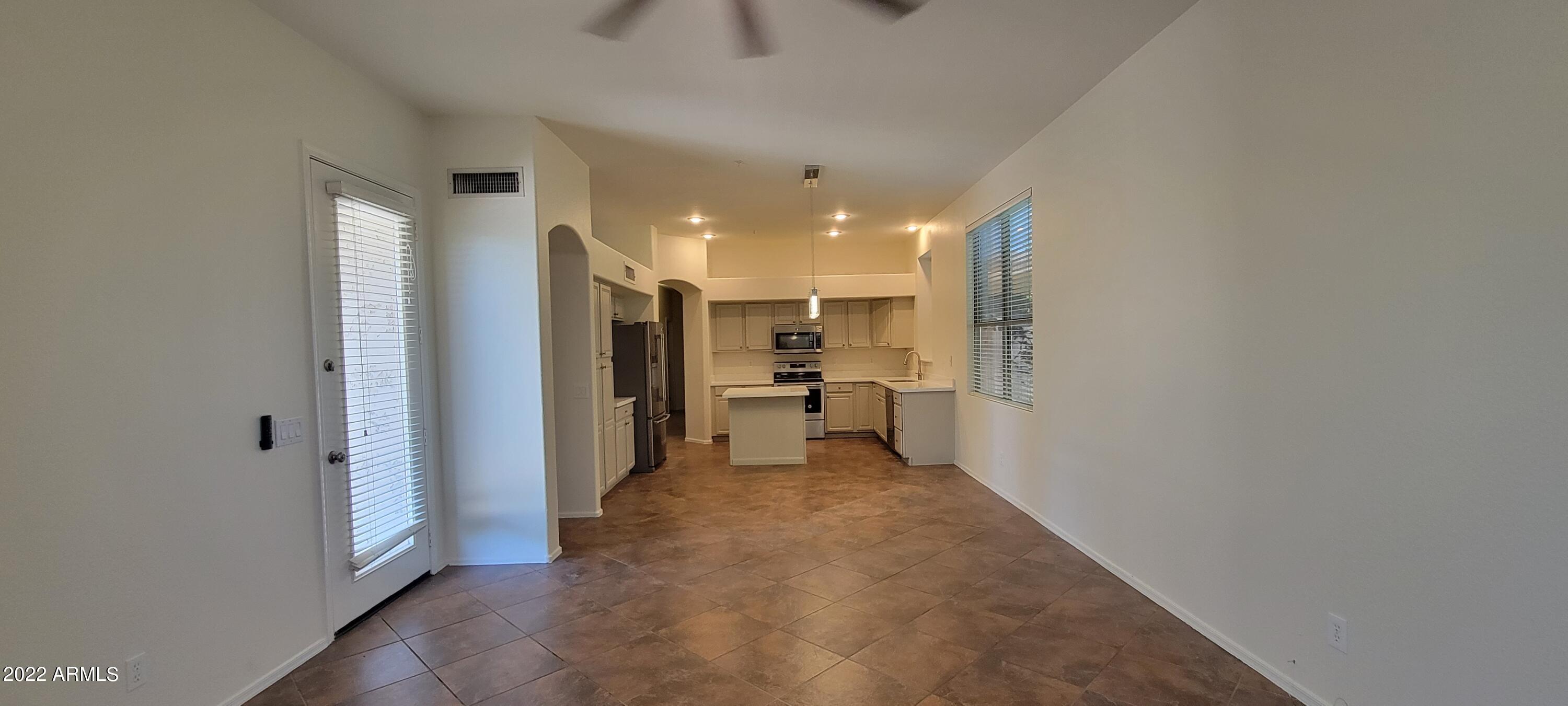 7323 East Overlook Drive Scottsdale, AZ 85255 - Photo 11 of 28 a view of a hallway with a kitchen