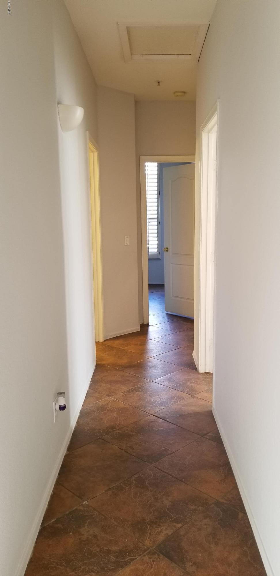 7323 East Overlook Drive Scottsdale, AZ 85255 - Photo 27 of 28 a view of a hallway with wooden floor