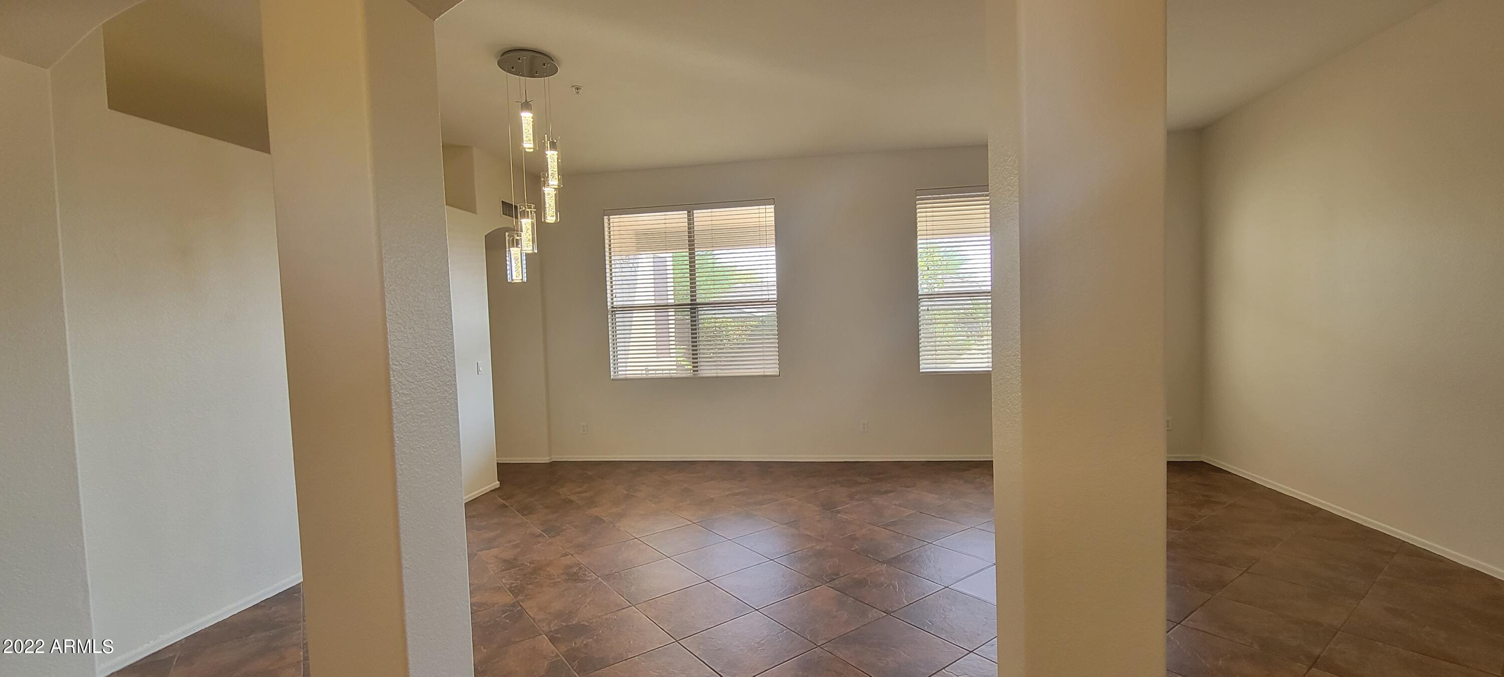 7323 East Overlook Drive Scottsdale, AZ 85255 - Photo 6 of 28 an empty room with wooden floor and windows