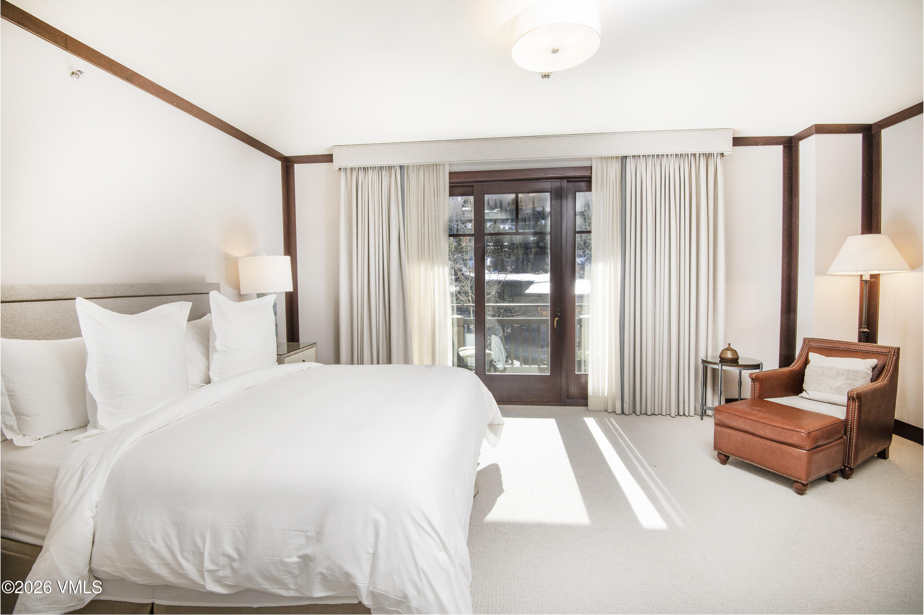 1 Vail Road, Unit 5102C Vail, CO 81657 - Photo 10 of 13 a spacious bedroom with a bed and a couch