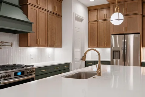 a bathroom with a double vanity sink a mirror and shower