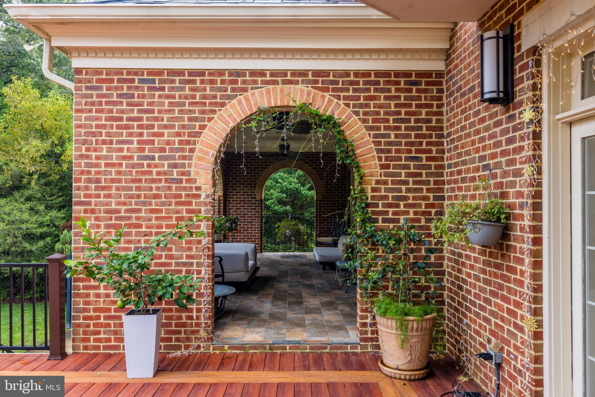 6832 Georgetown Pike McLean, VA 22101 - Photo 17 of 25 a front view of a house with a garden