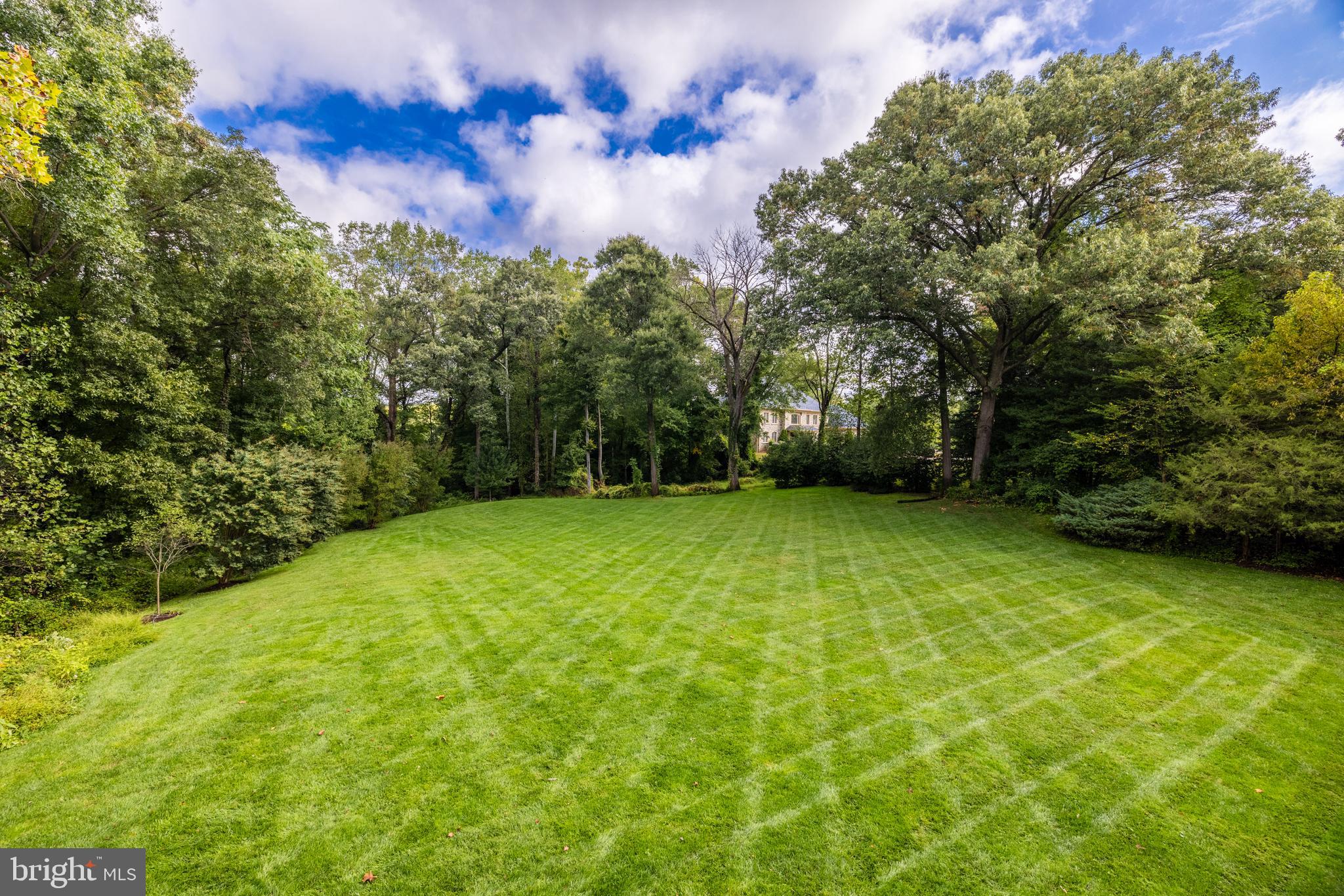 6832 Georgetown Pike McLean, VA 22101 - Photo 20 of 25 a view of a yard with a house in the background