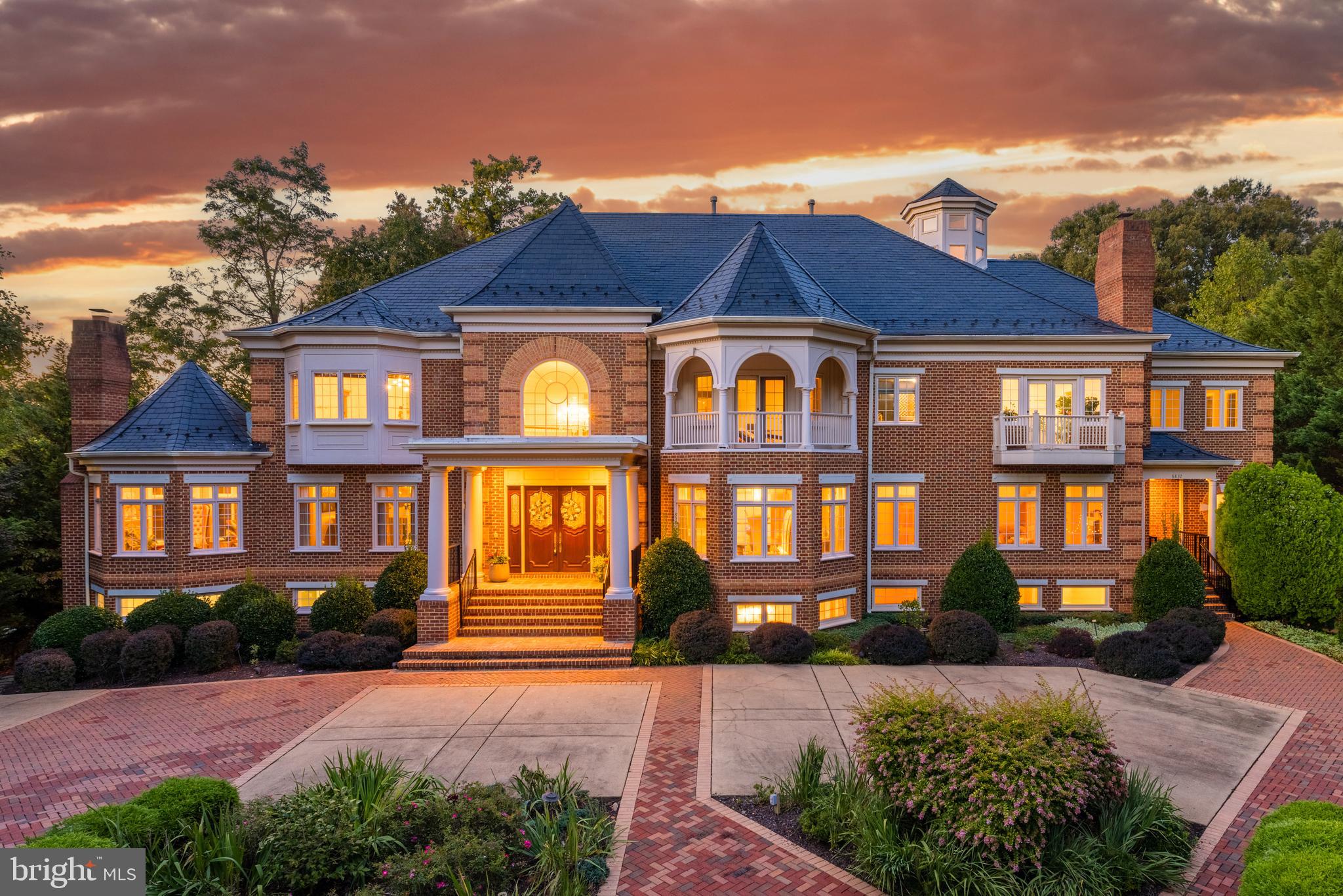 6832 Georgetown Pike McLean, VA 22101 - Photo 2 of 25 a front view of a house with a yard